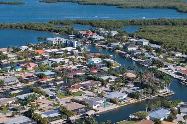 view from the air of homes on the coastline